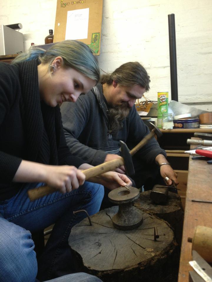 Working in the workshop, people hammering